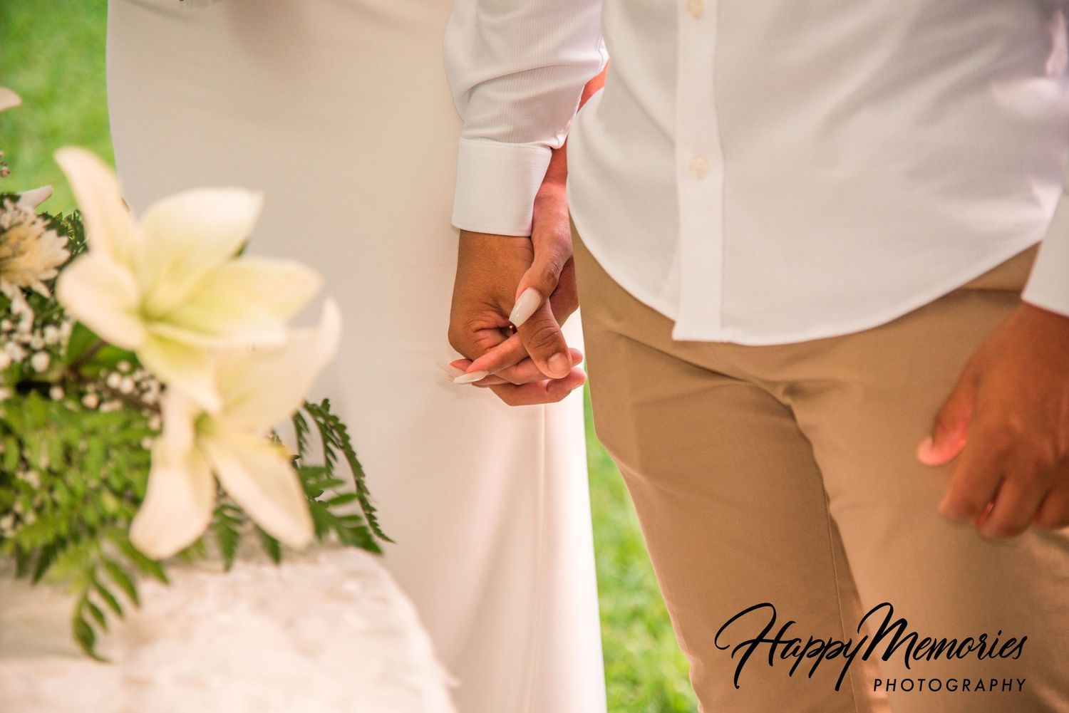 Elegant wedding details with white lilies and floral arrangements.