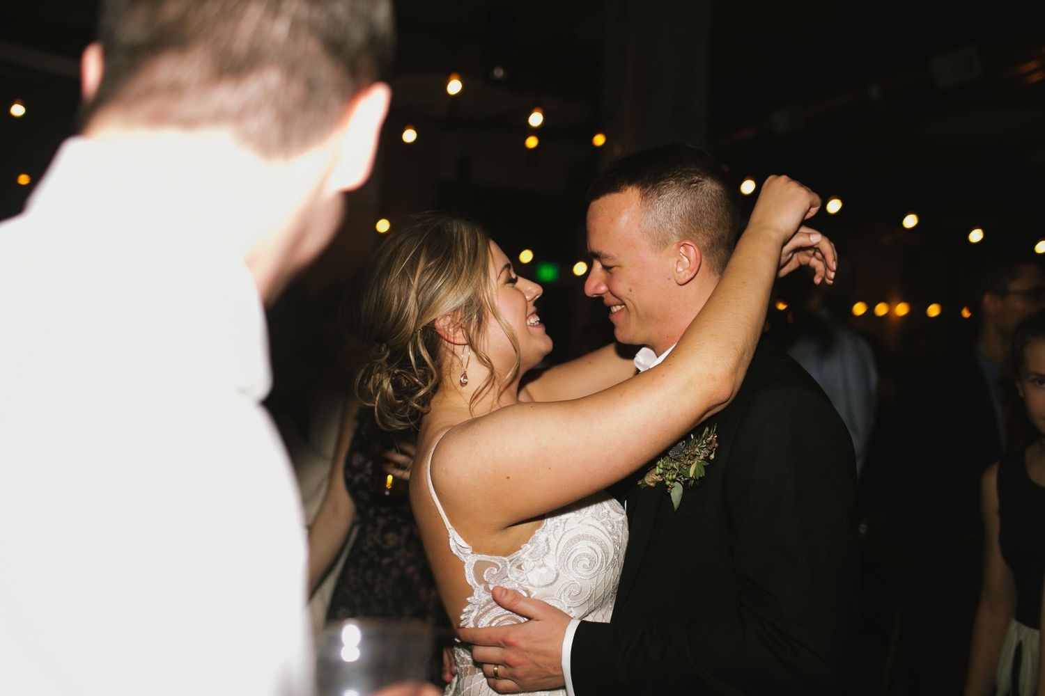 Couple sharing an intimate dance moment at their wedding reception.
