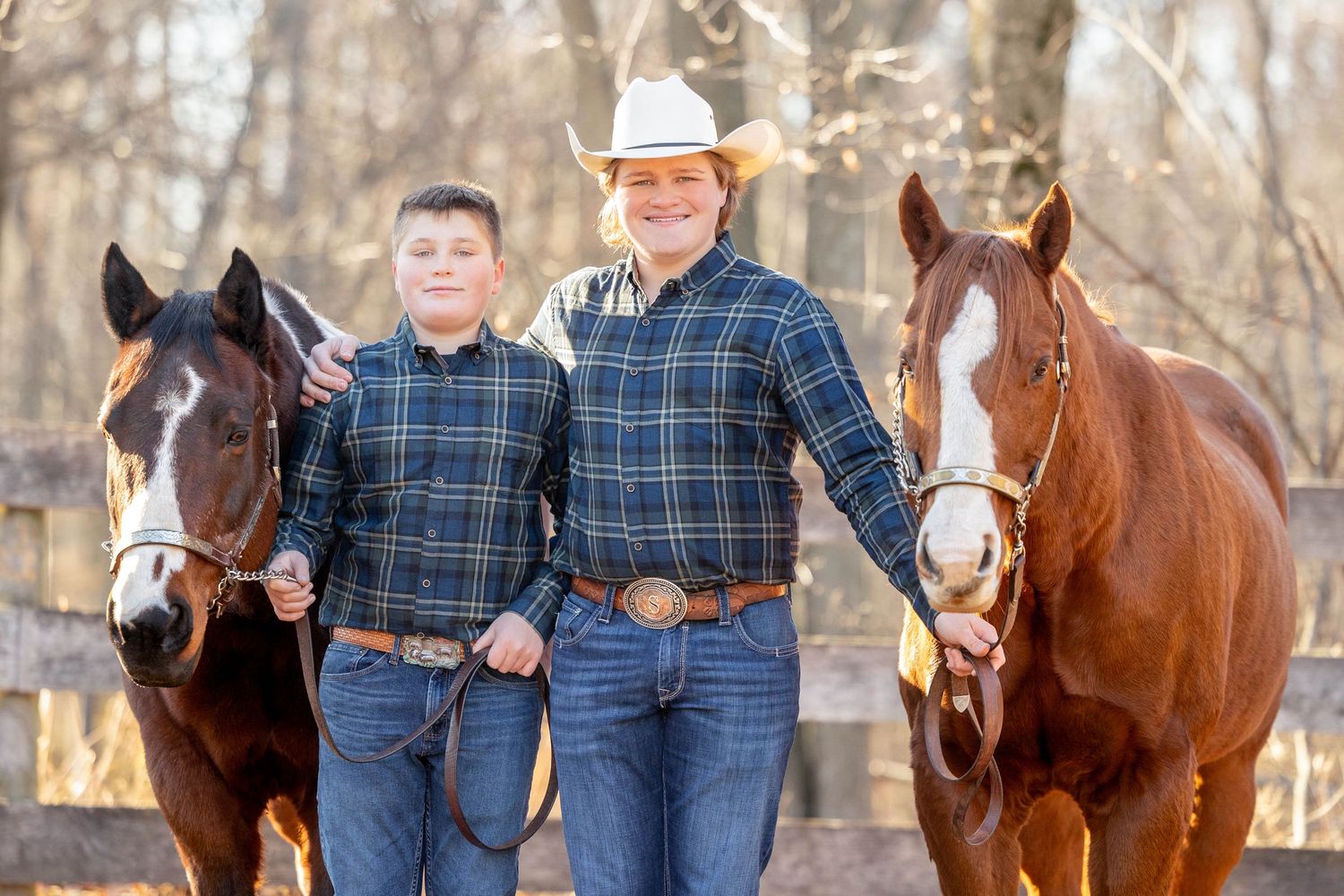 two boys and their horses