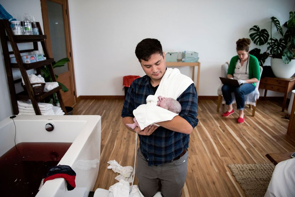 Dad holding his newborn
