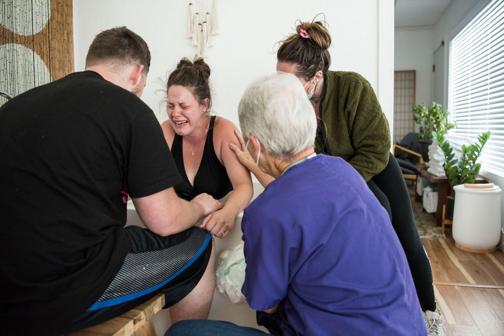 active labor with doula comforting