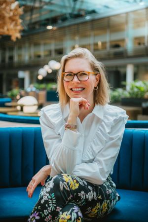 Portrait photograph of a blonde business woman in the world world trade center in amsterdam