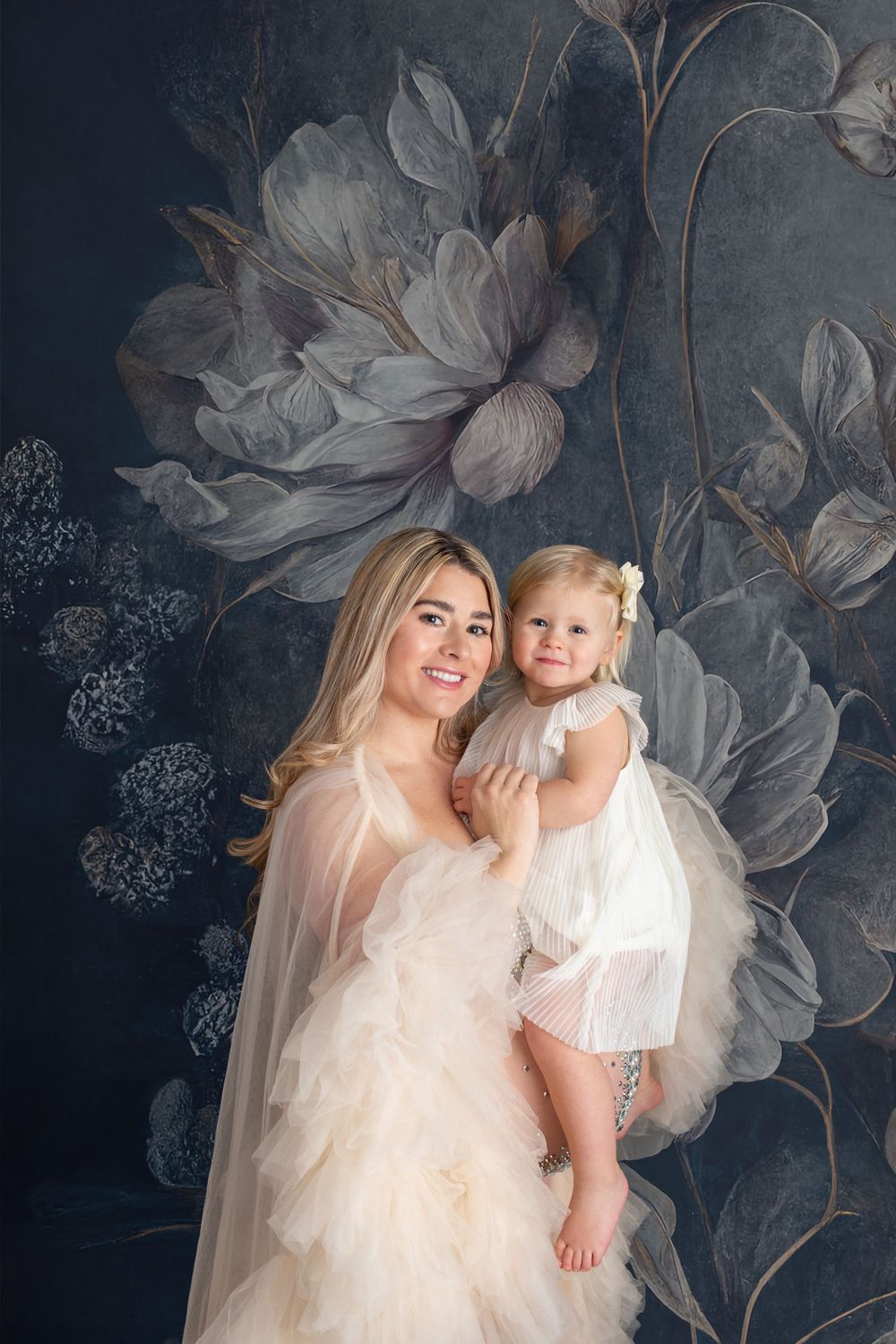 beautiful woman posing with newborn for picture in Barrington RI