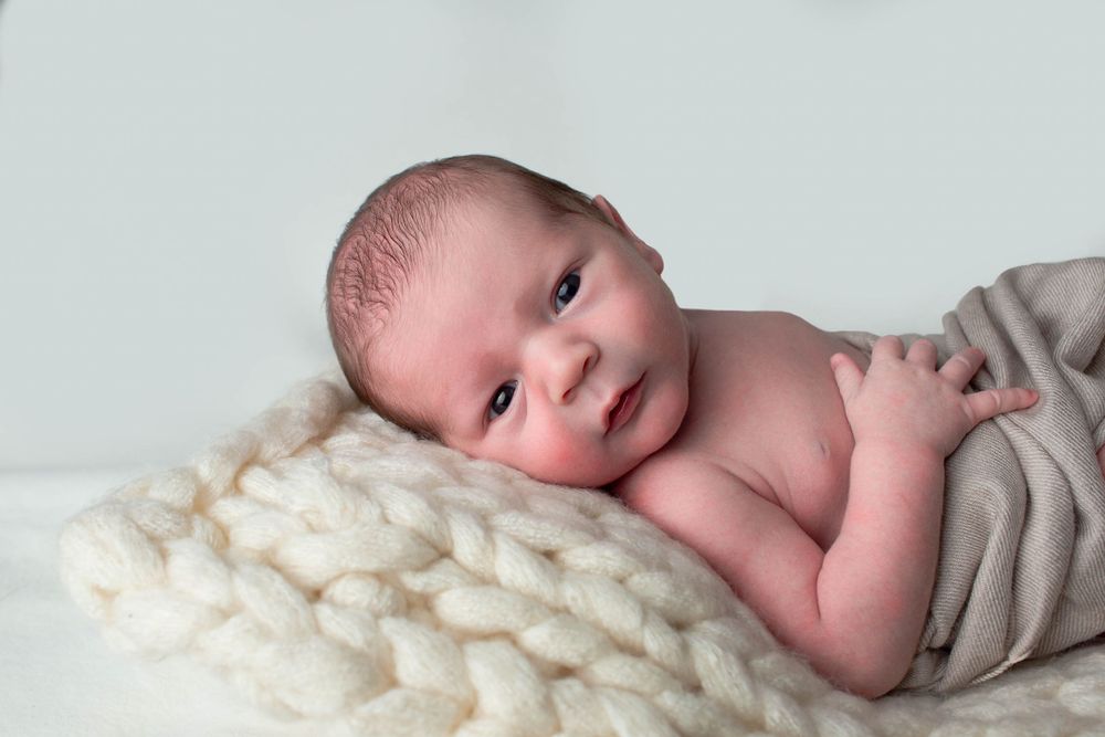 adorable baby posing for newborn photography in barrington ri