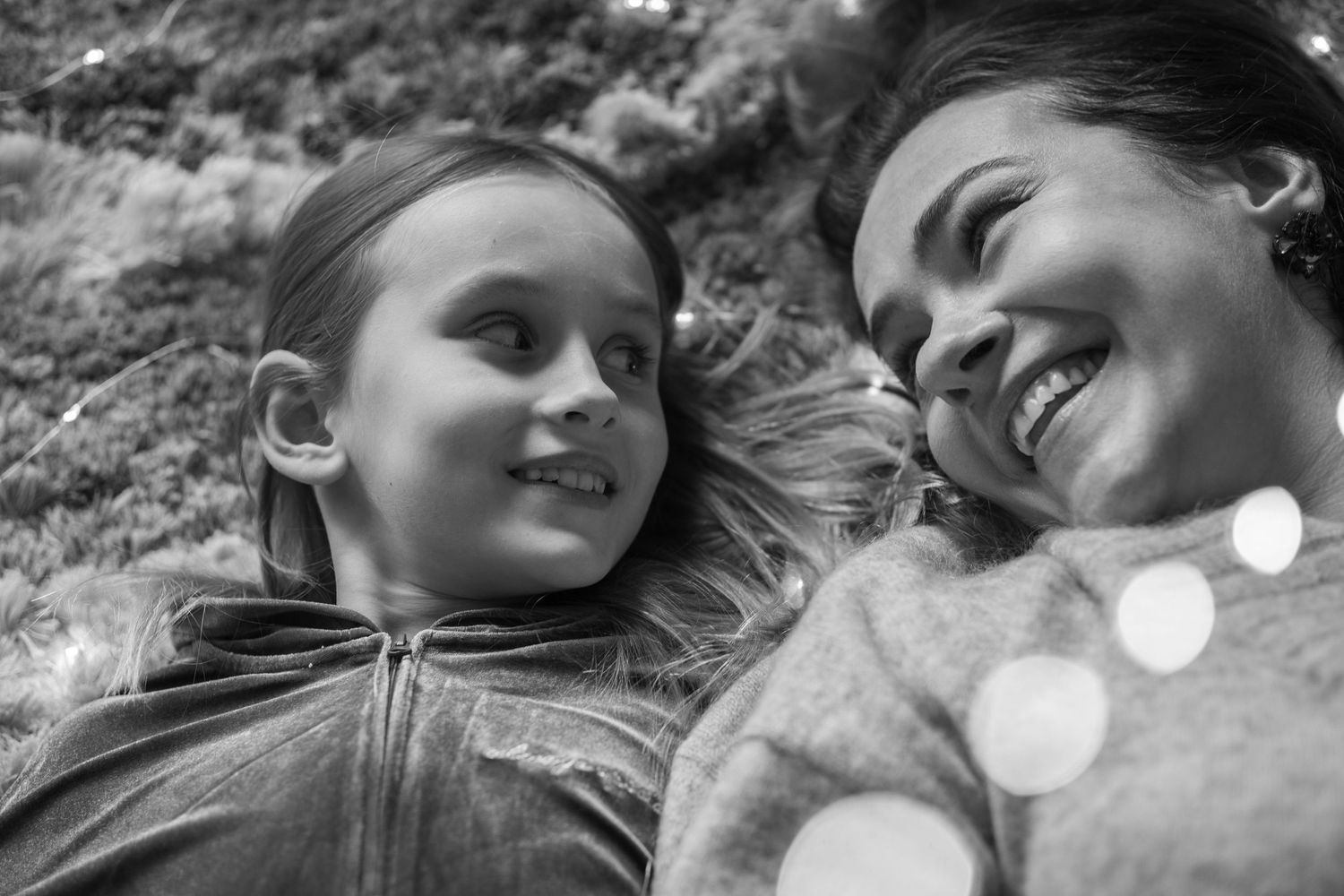Mother and daughter are looking at each other.