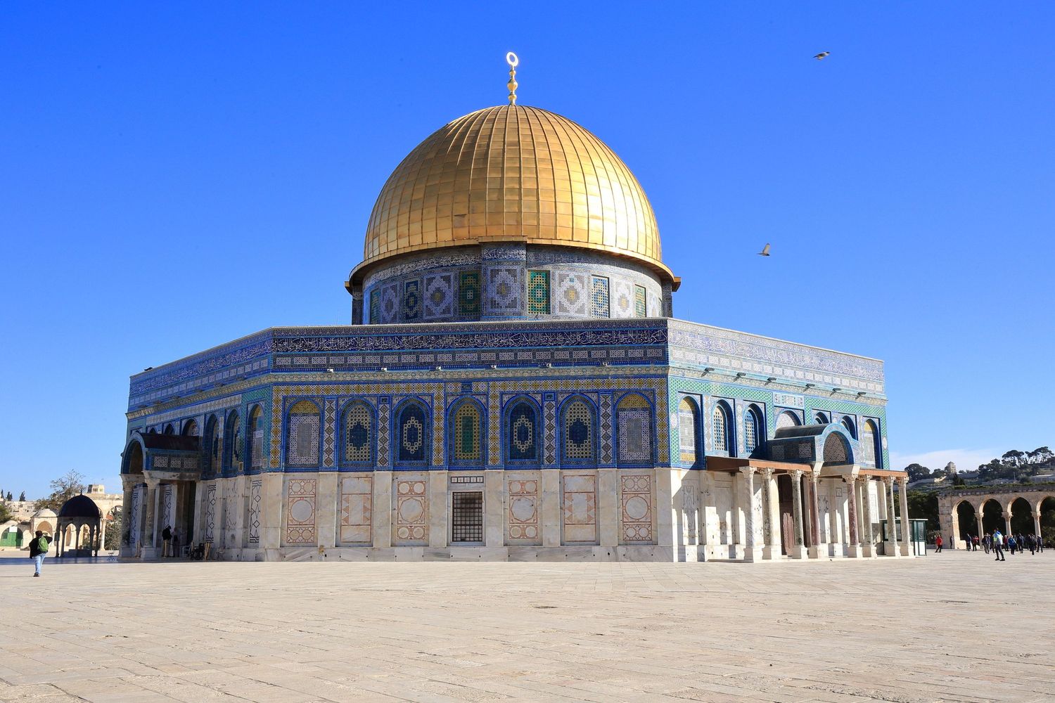 The Dome of the Rock mosque with its golden dome stands majestically on the Temple Mount in Jerusalem on a clear day.