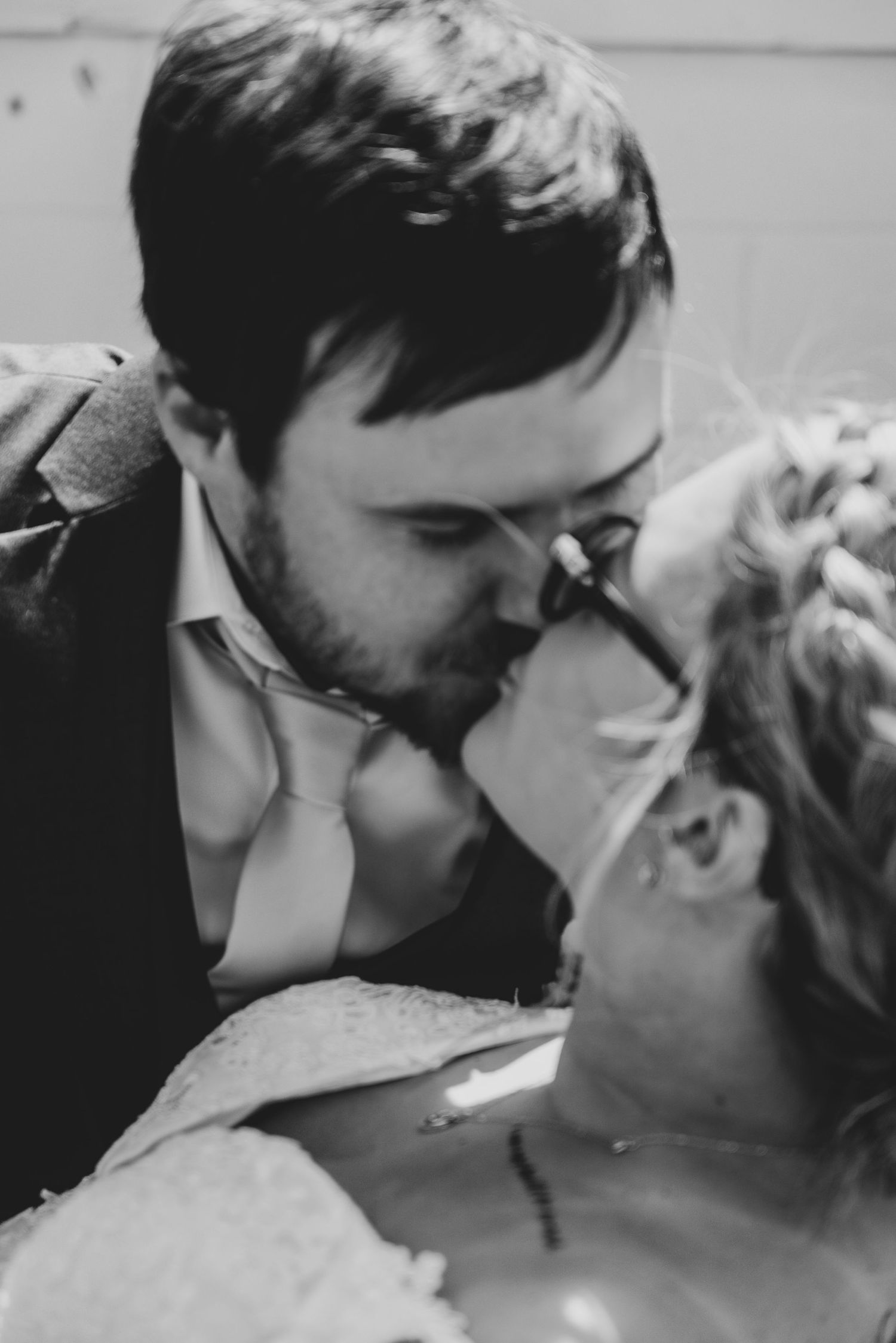 Black and white romantic close-up portraits showing intimate moments.