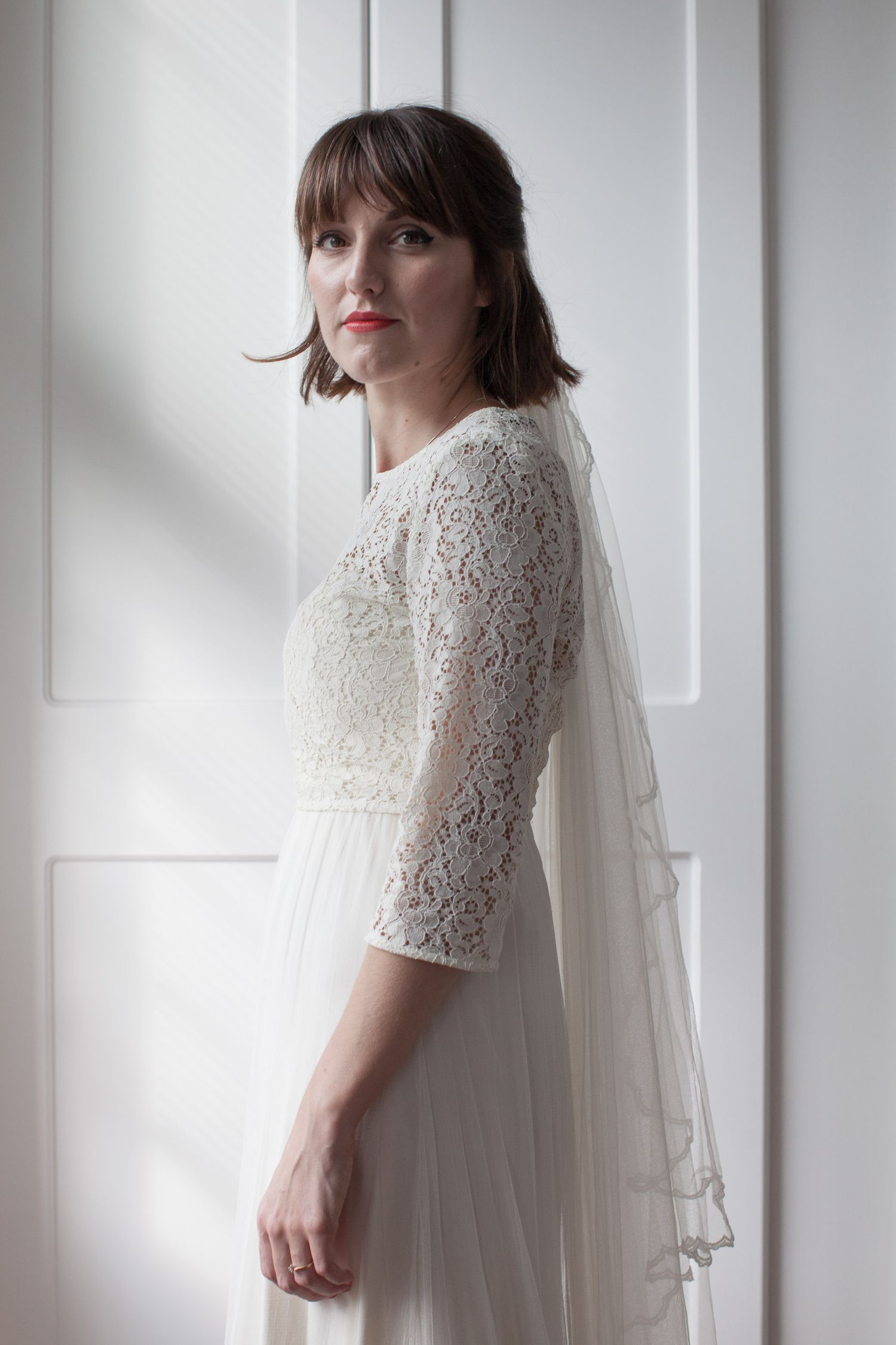 Bride in wedding dress. Looking directly at camera