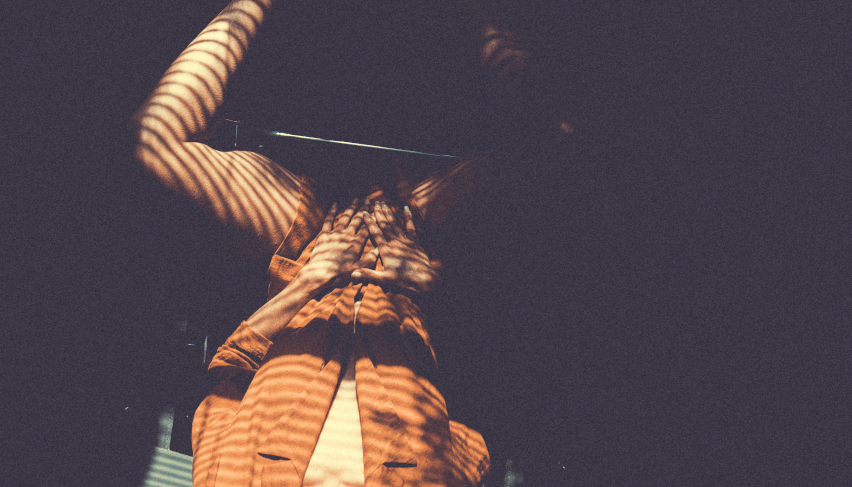 Low angle view of illuminated architectural statue against dark night sky.