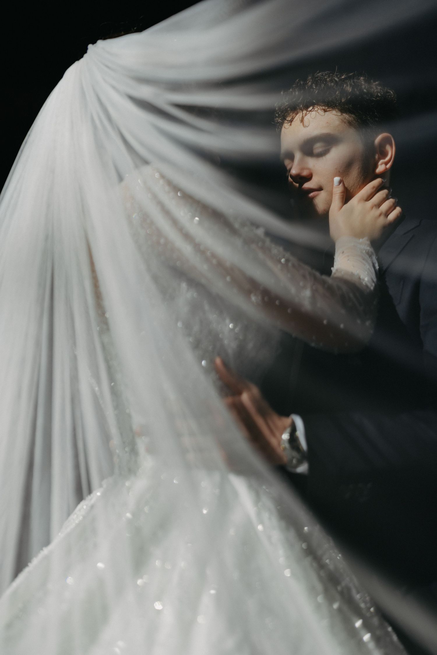 Bride and Groom under the veil