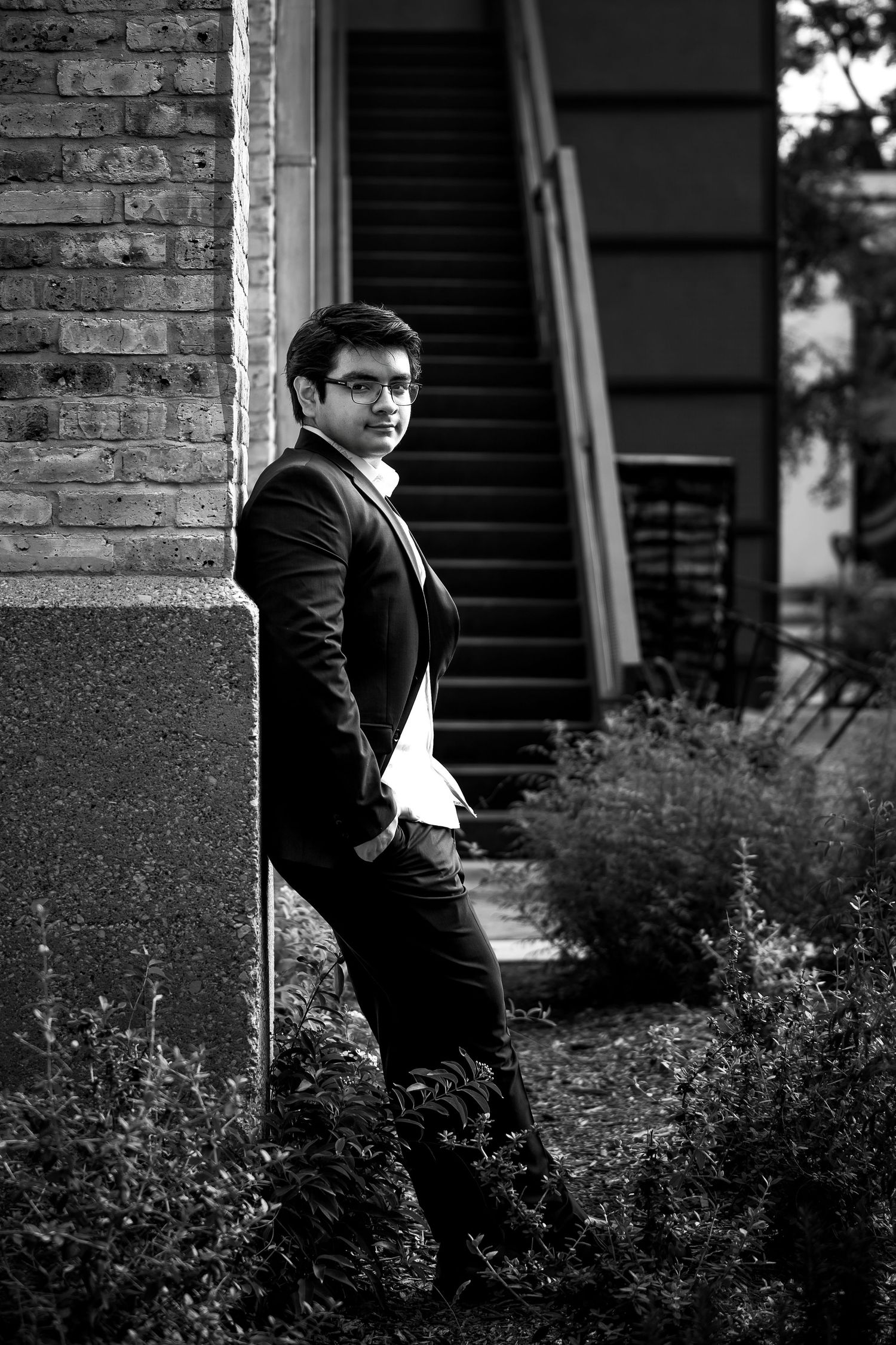 The Historic Pearl San Antonio Texas portrait of high school senior boy standing against brick wall