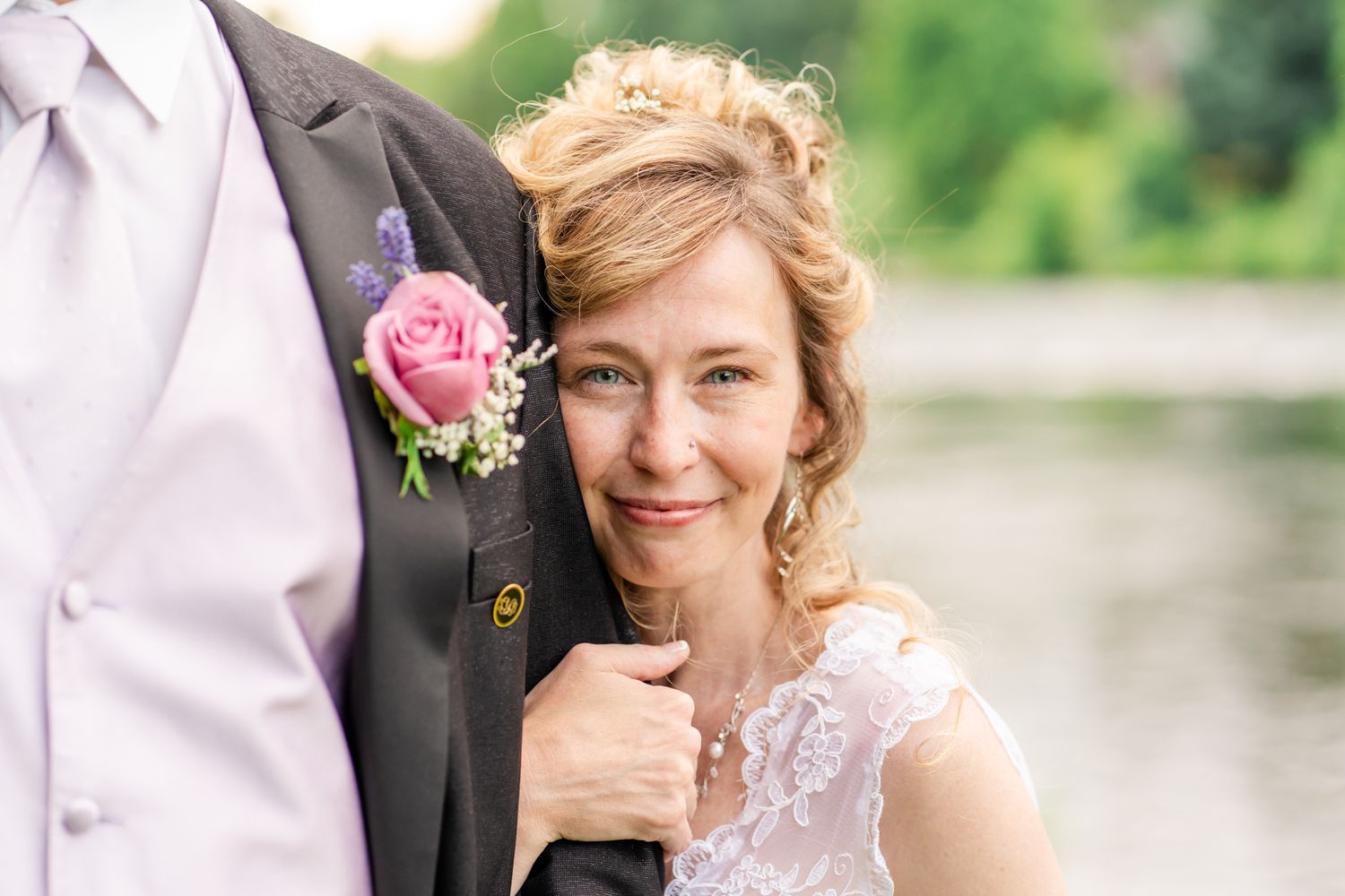 portrait of bride on groom's shoulder