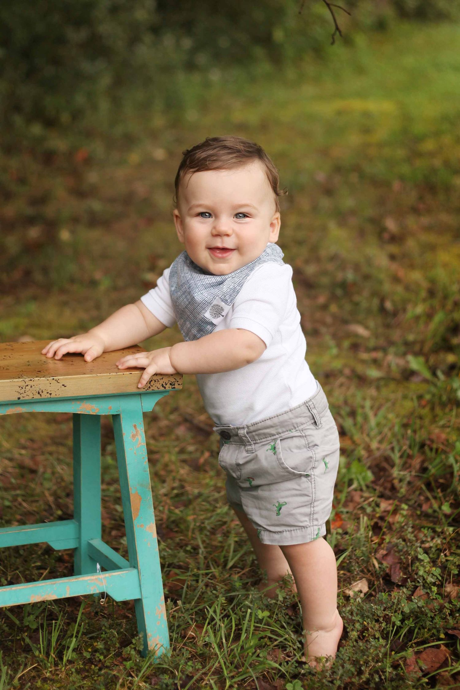 baby boy standing with a stool by victoria leigh photography