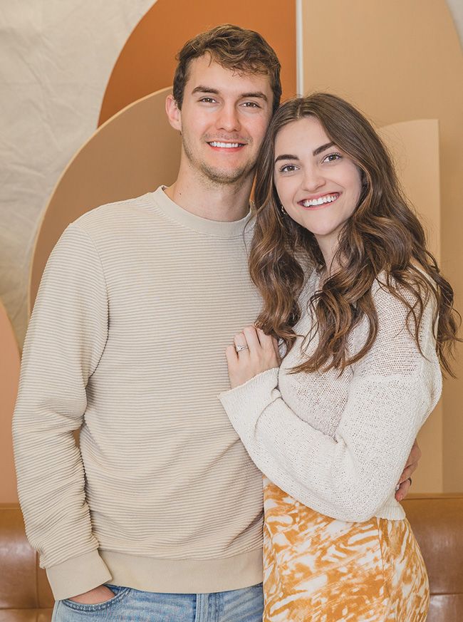 Young couple smiling with the wife's head on the husband's shoulder