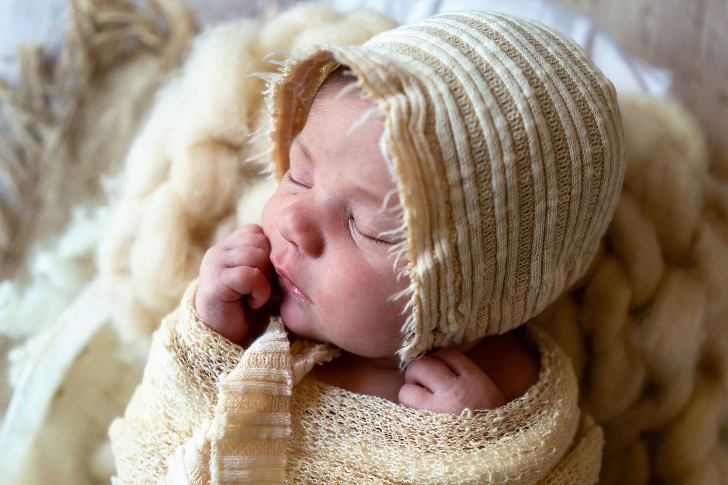 newborn baby girl with bonnet