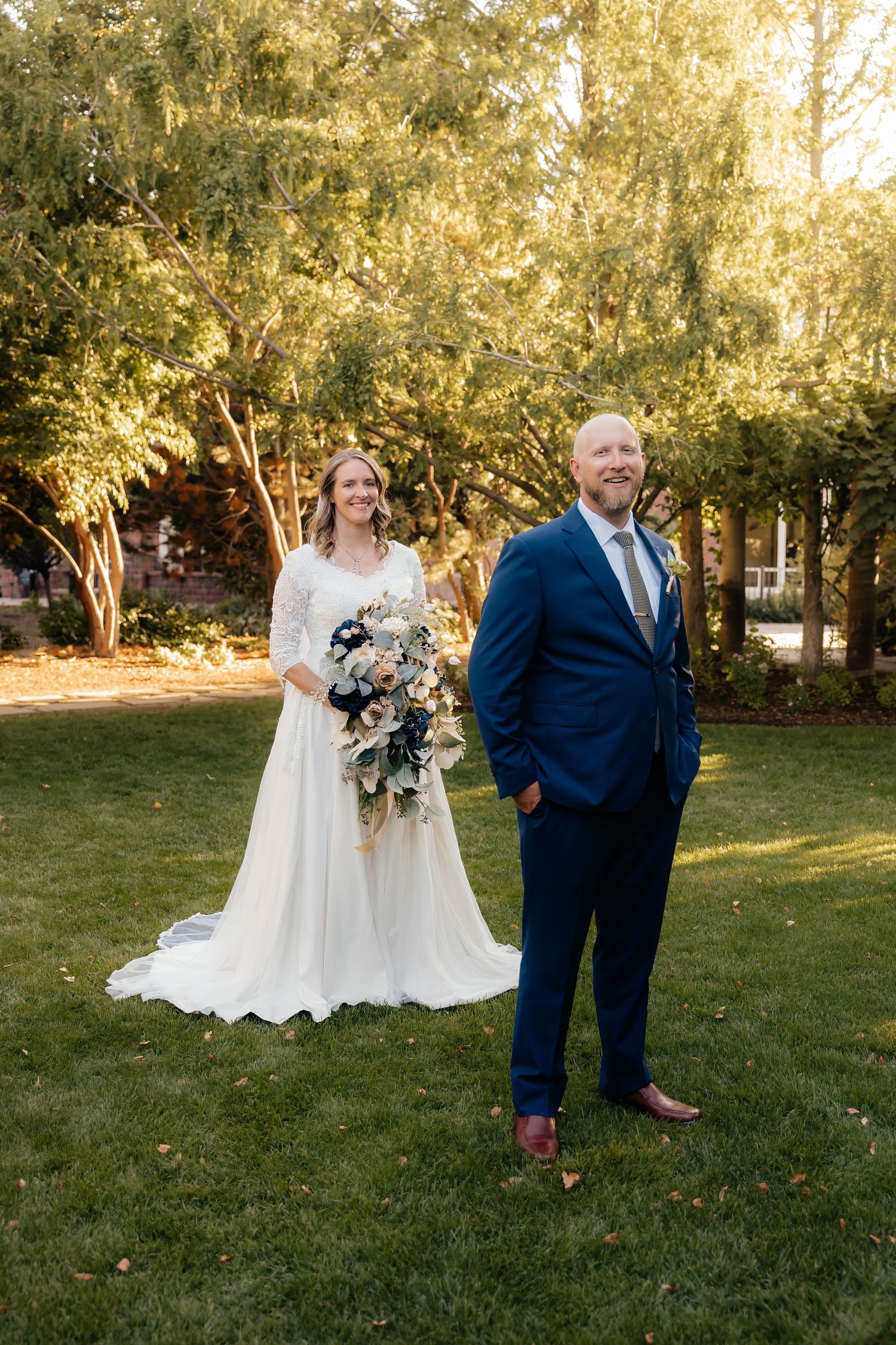Bride standing behind groom waiting for first look