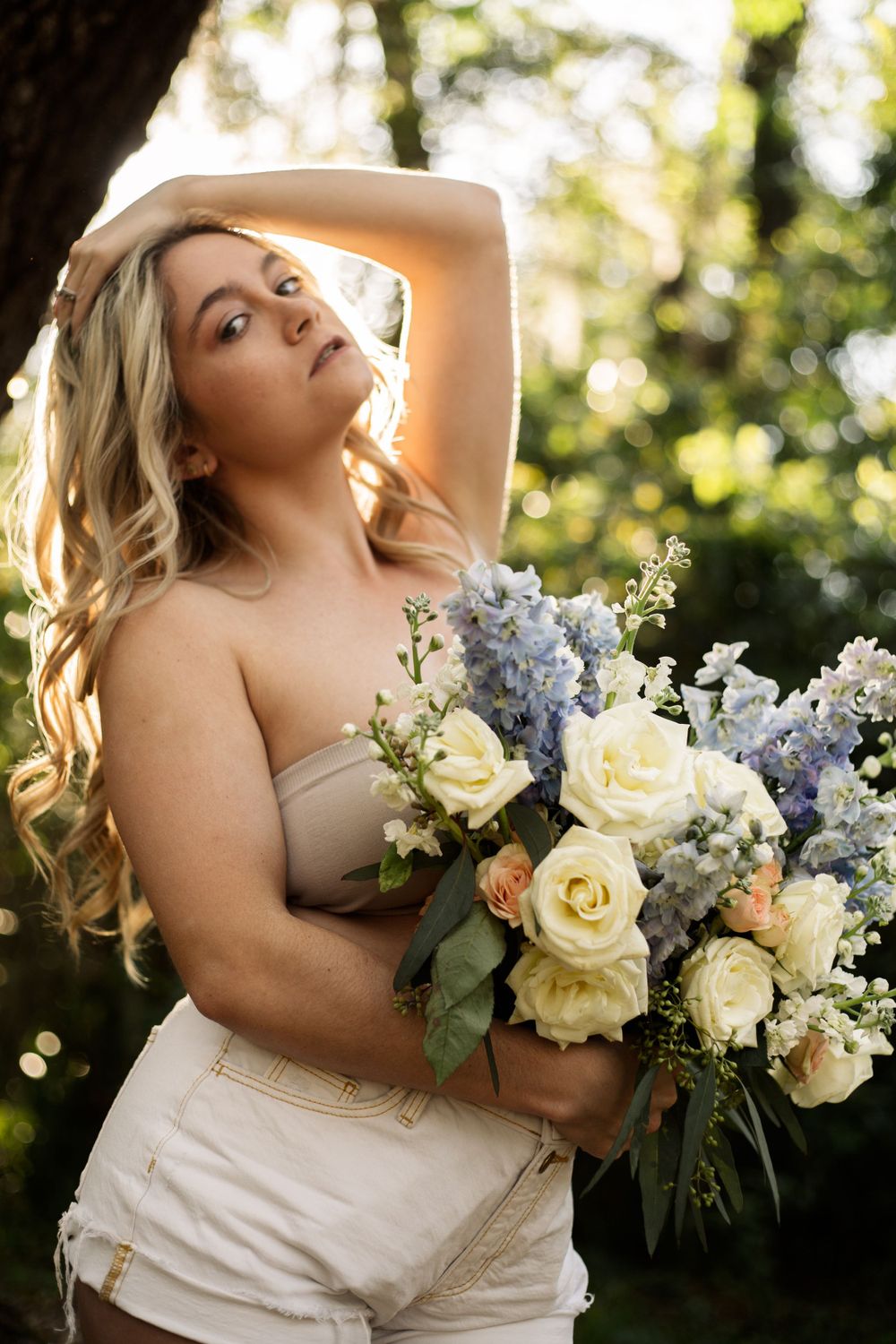Artistic outdoor photo featuring a beautiful floral arrangement in natural sunlight.