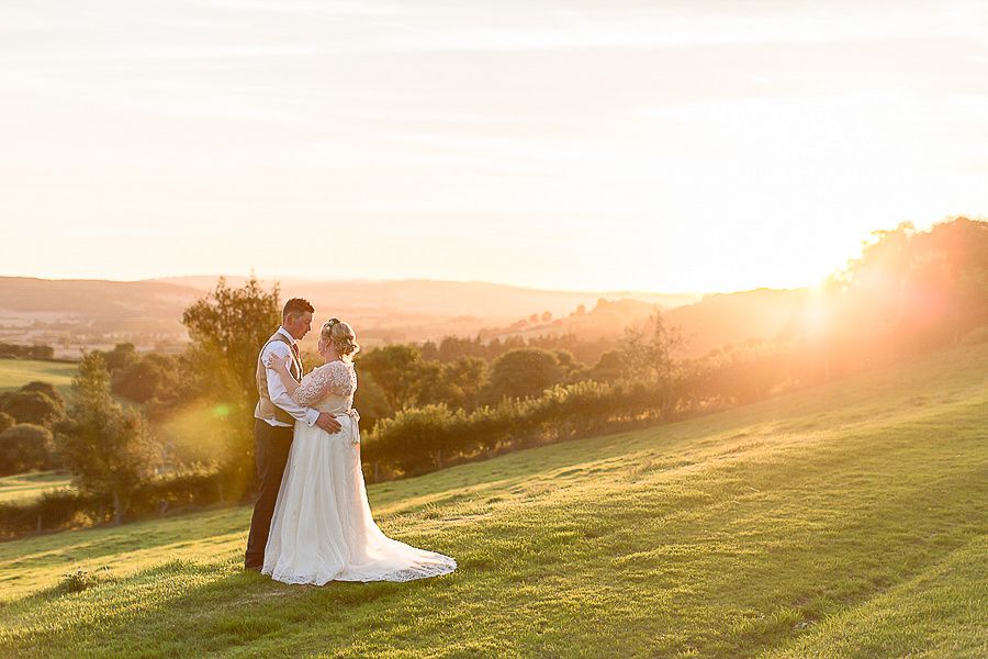 Hayley Elizabeth Photography Wedding couple portrait of bride and groom at the bringewood in the sunset