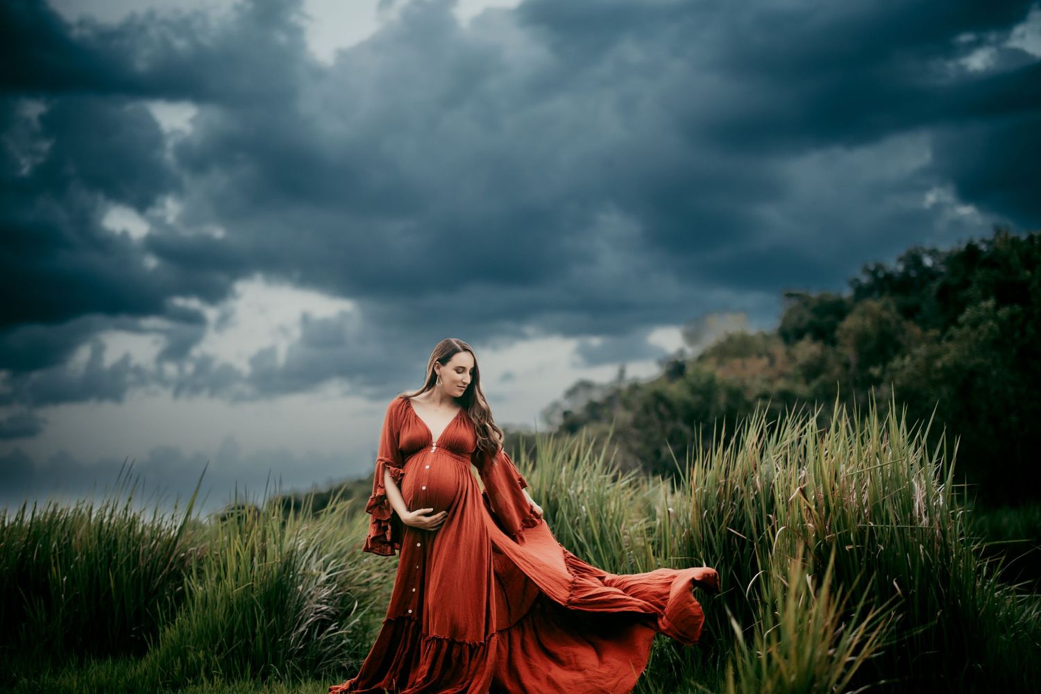 Lakeland Family Photographer- pregnant mom swinging dress in storm