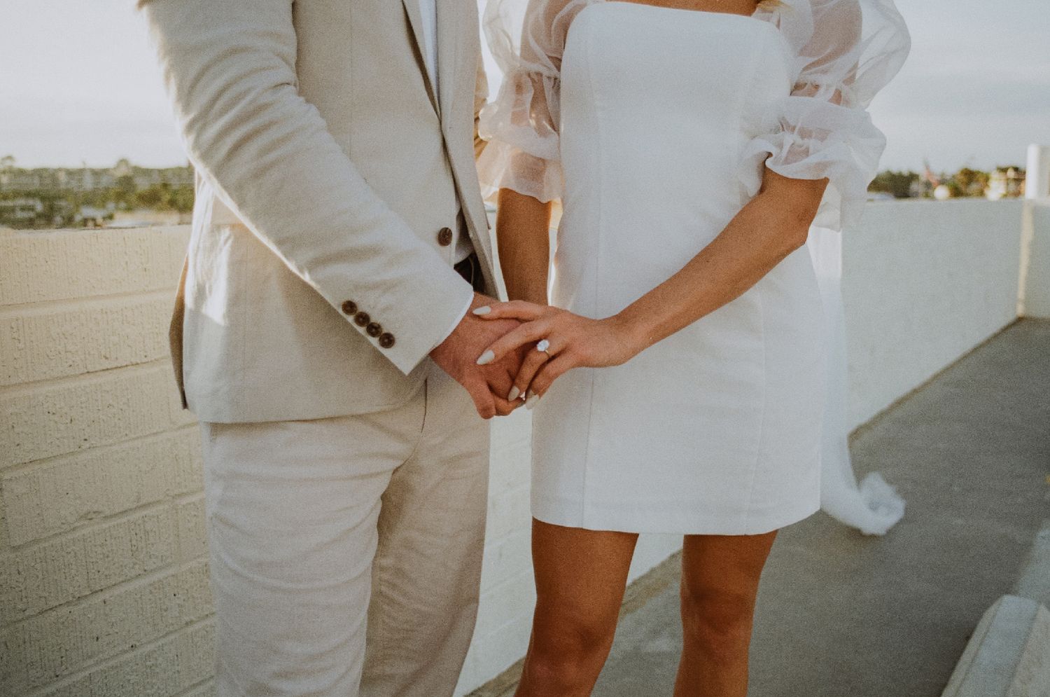 35mm film photo of fun bridal themed engagement shoot on roof of parking structure in Lido Marina, Newport beach