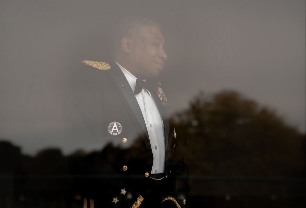 Military formal dress uniform with bow tie in evening light.