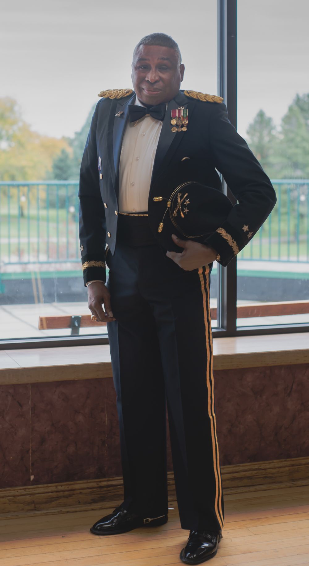 A formal military dress uniform with medals and decorations.