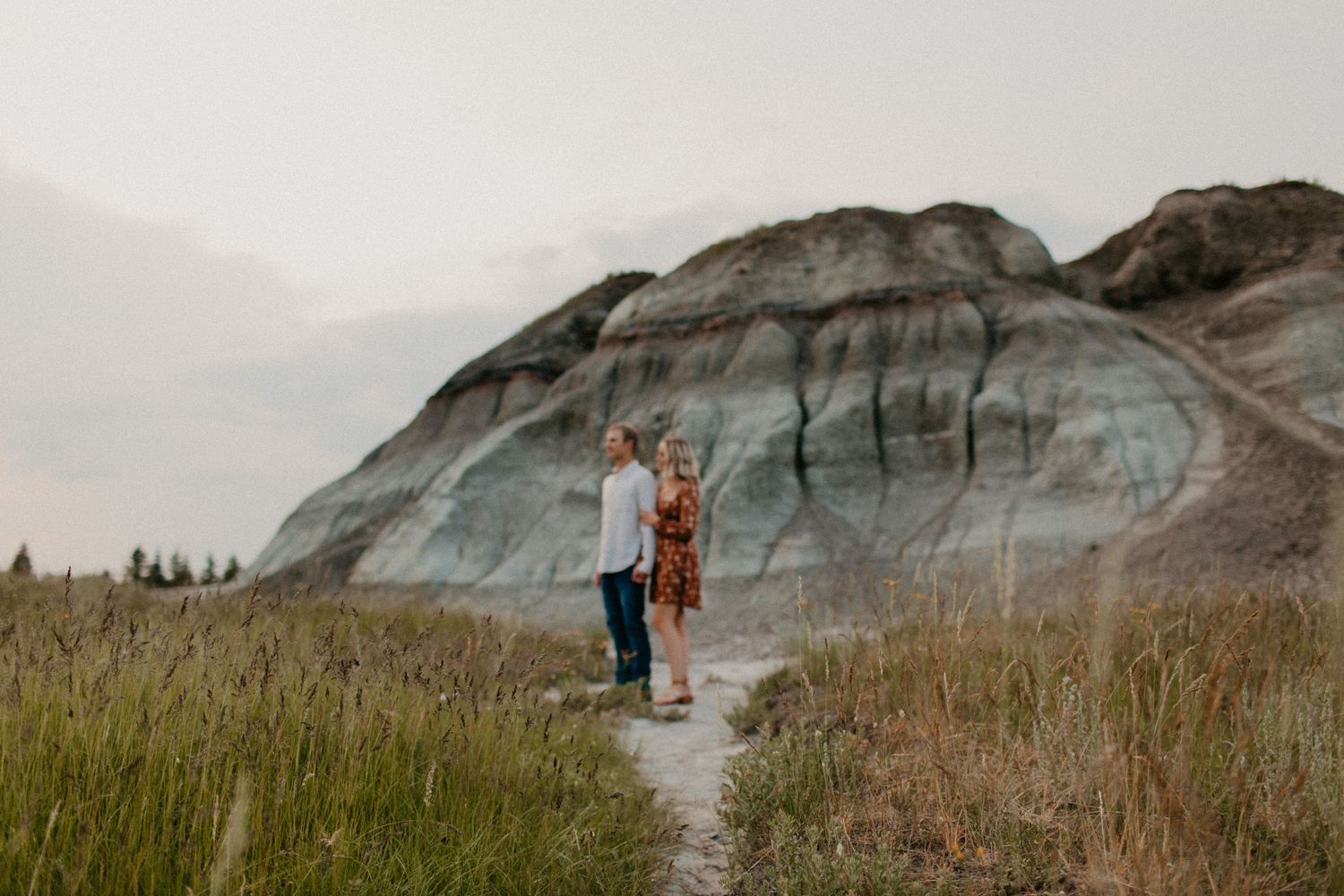 A couple poses in a natural park near Grande Prairie Alberta
