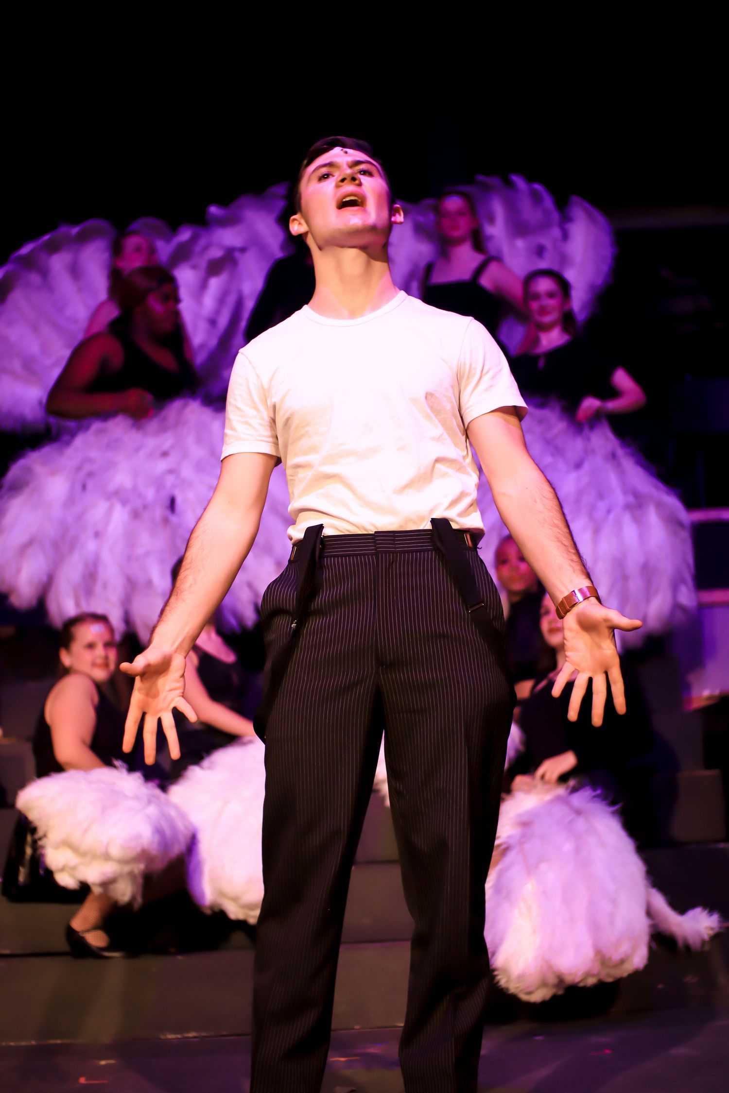 Actor from CHICAGO posing while singing