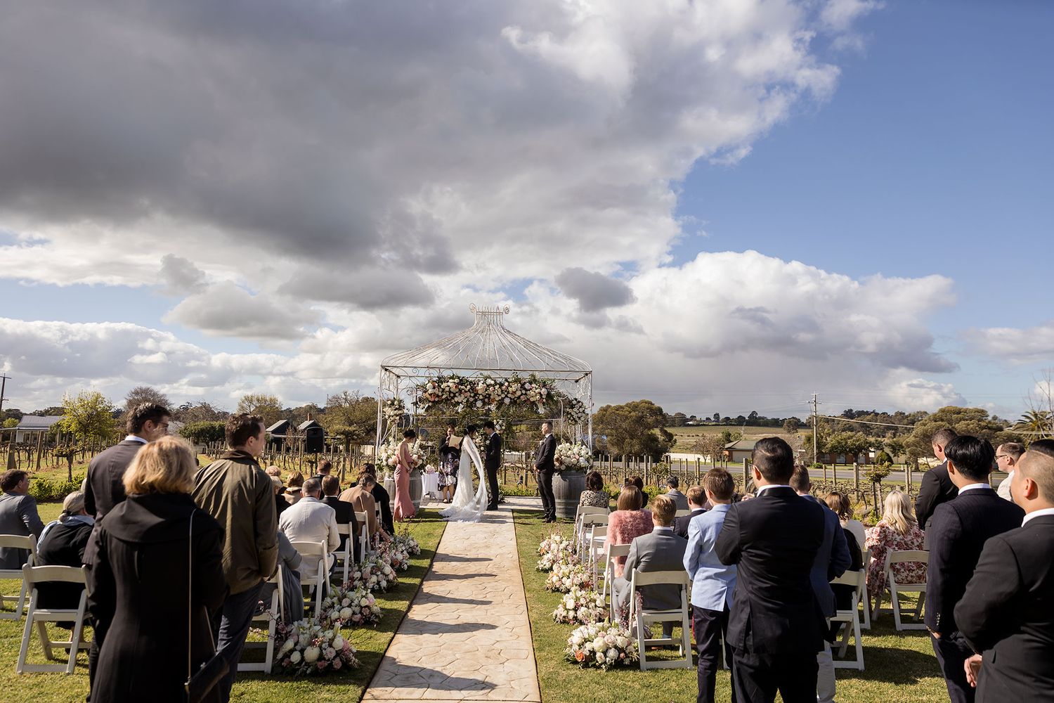 Bride and Groom exchanging their wedding vows at De Bortoli Rutherglen Estate captured by Jason Robins Photography
