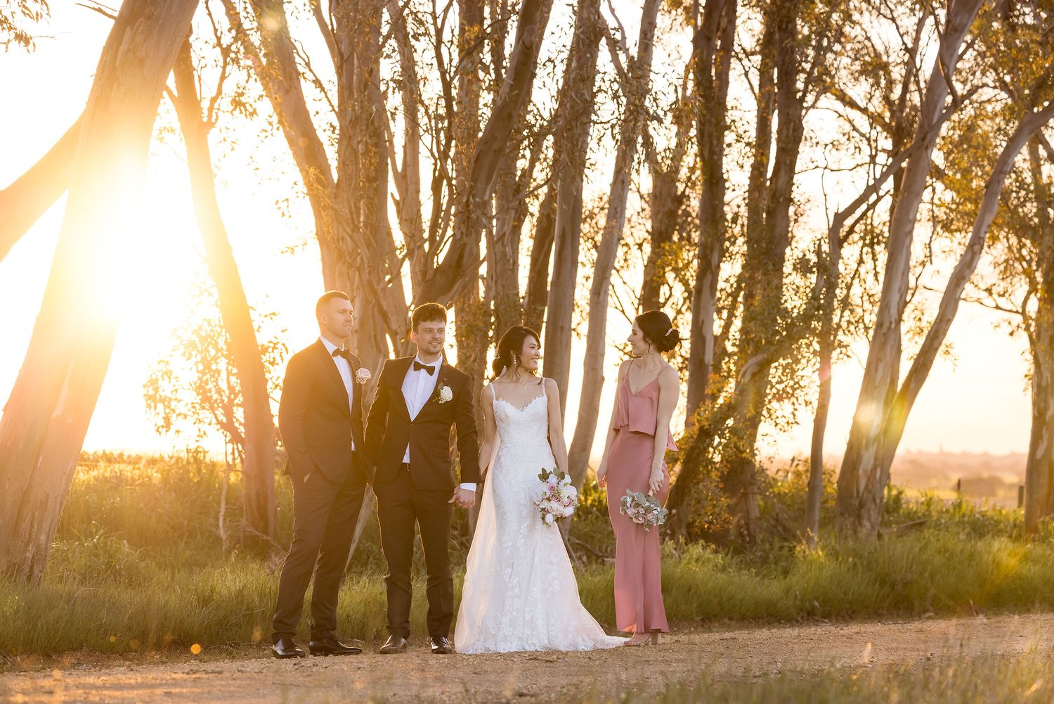 Bridal Party laughing during sunset at De Bortoli Rutherglen Estate captured by Jason Robins