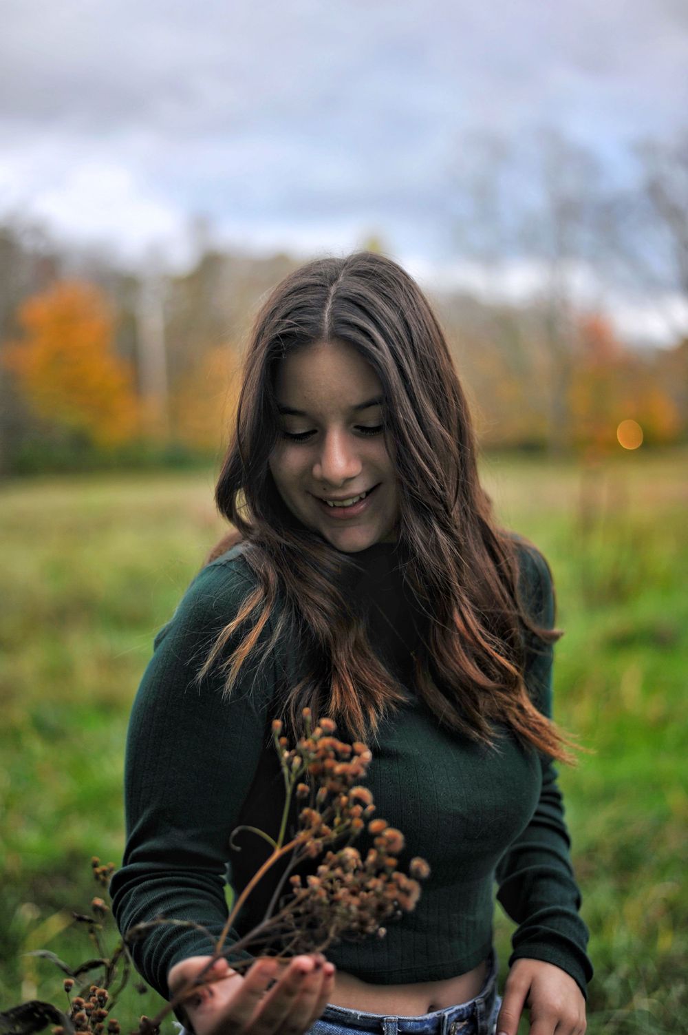 Girl portrait grassy field fall foliage