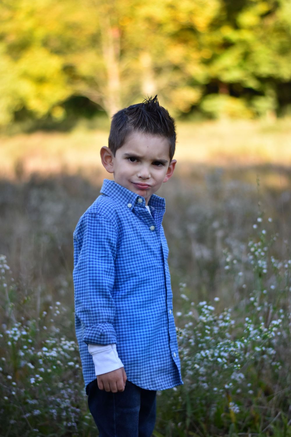 Zoolander school boy portrait in grassy fall field