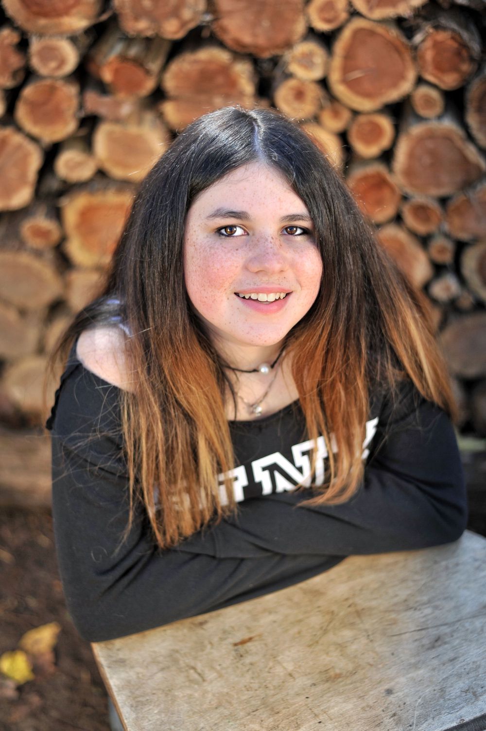 Teen portrait at vintage school desk wood round wall