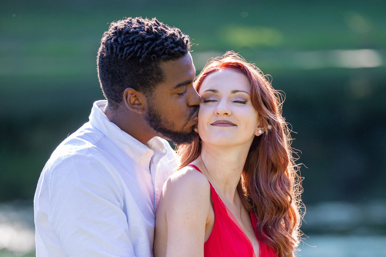 fiance kisses fiance's cheek engagement photo