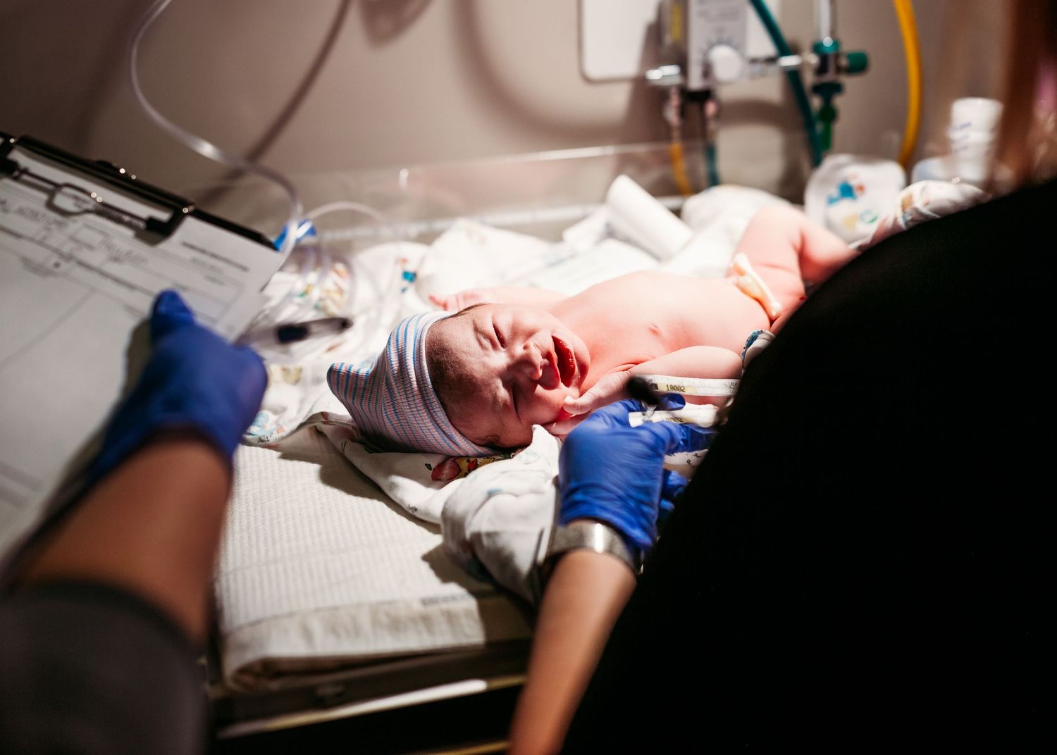 newborn baby immediately after birth captured by tulsa birth photographer