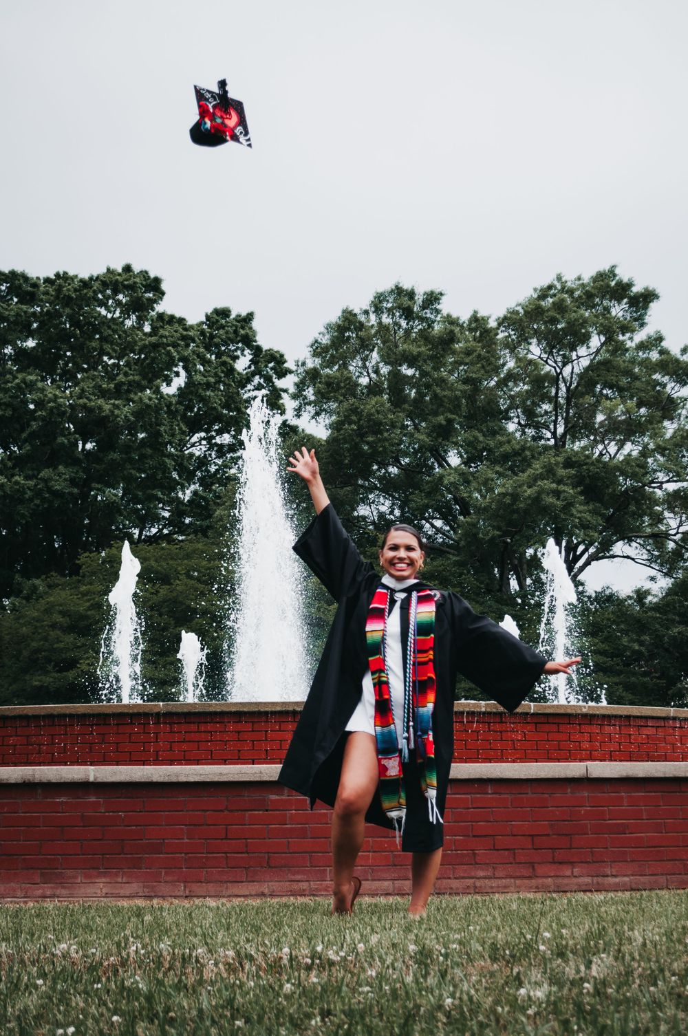 College cap and gown celebration toss, Hispanic heritage