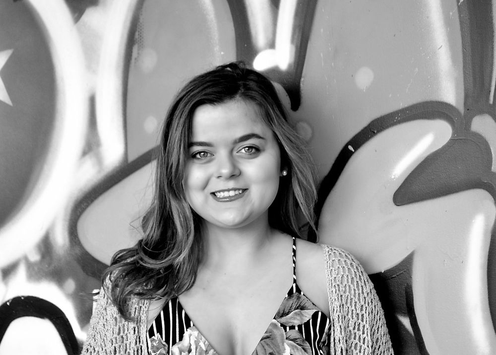 Senior session graffiti wall in urban area