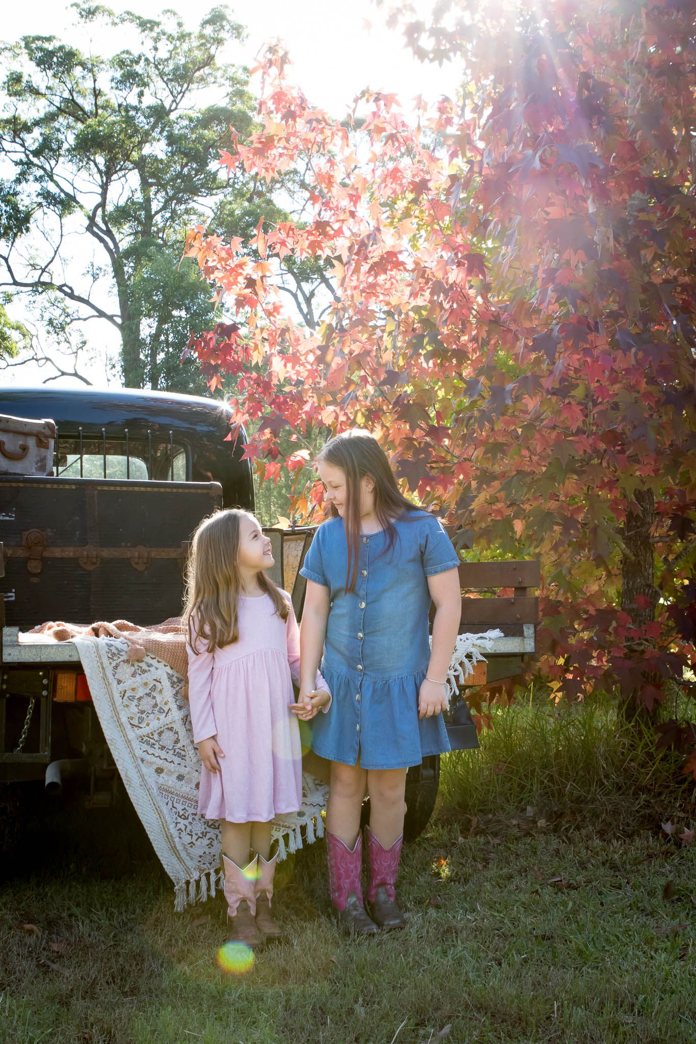 Two sisters looking at each other during Autumn