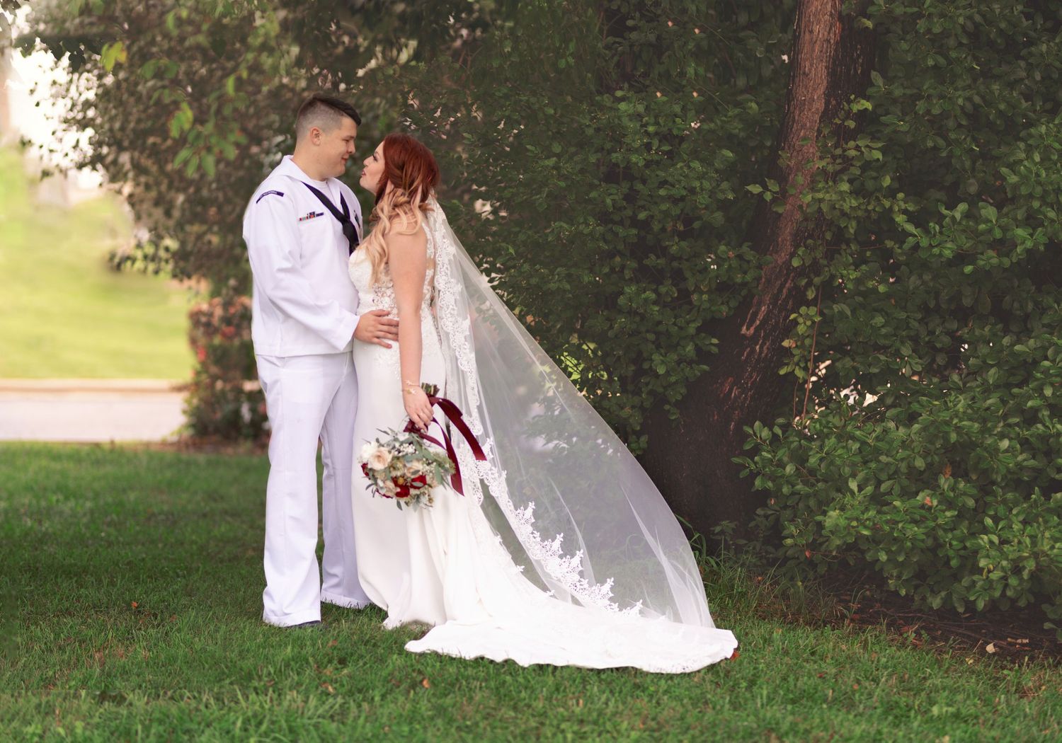 Wedding at 910 Balloroom in Springfield MO Bride and Groom. Navy uniform