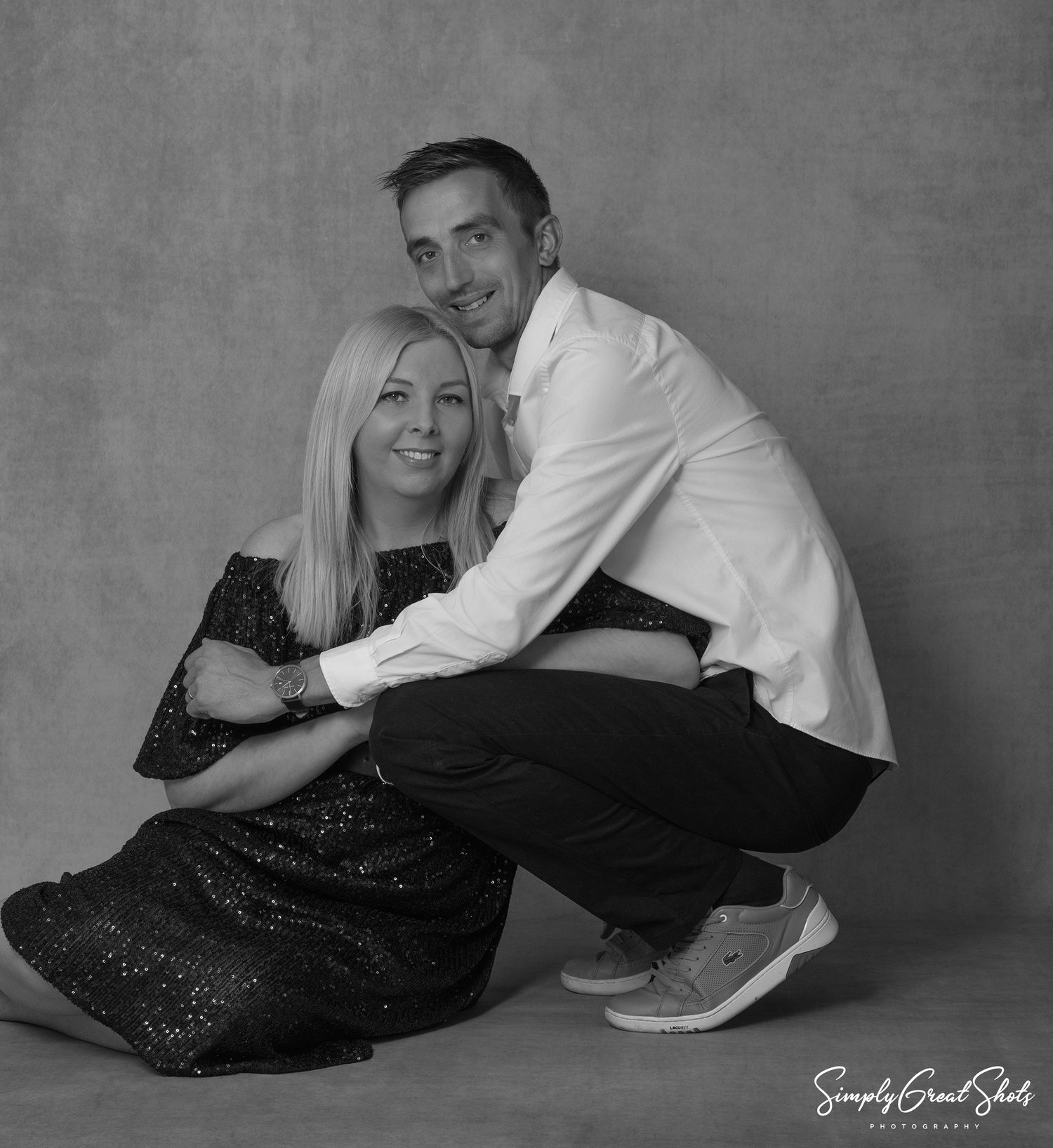 A portrait photograph of a loving husband and wife.