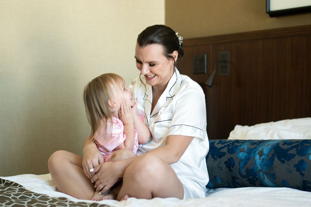 flower girl getting ready with bride