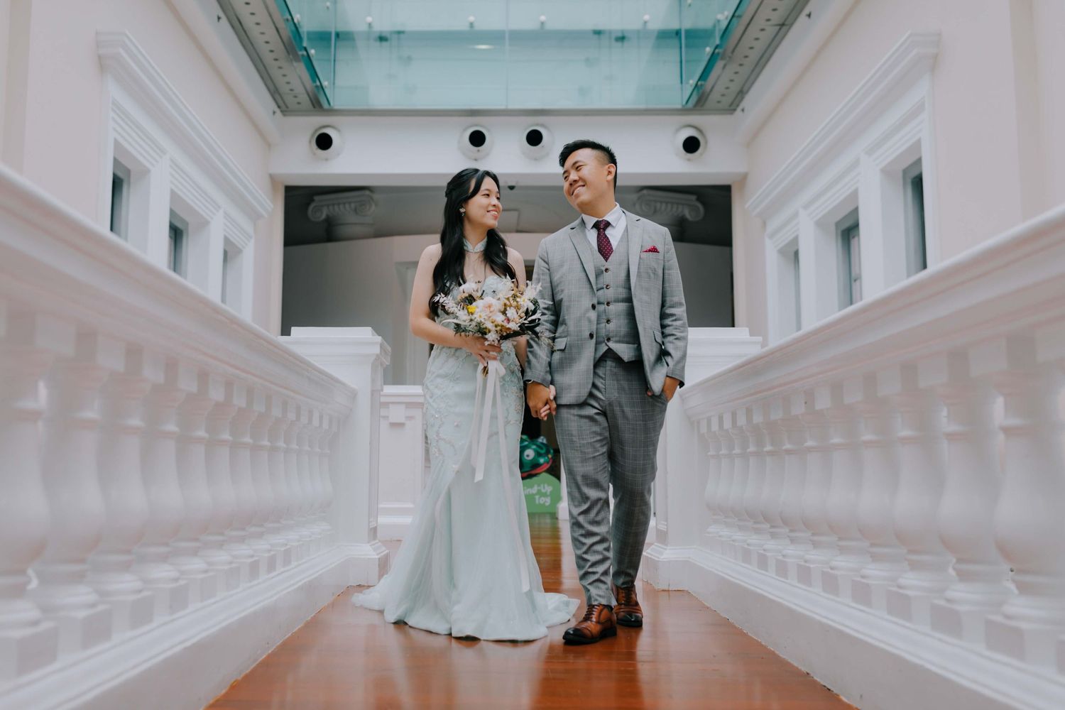 whimsical and candid wedding photography at singapore national museum by a documentary-style wedding photographer