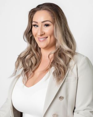 Professional headshots of a woman in white top and cream blazer against white background.