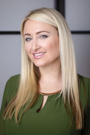 Professional headshot series in olive green top against gray studio background.