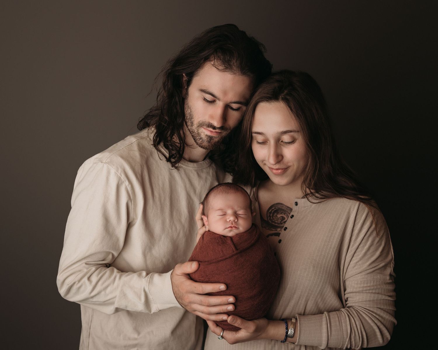 Professional newborn photo with mom and dad