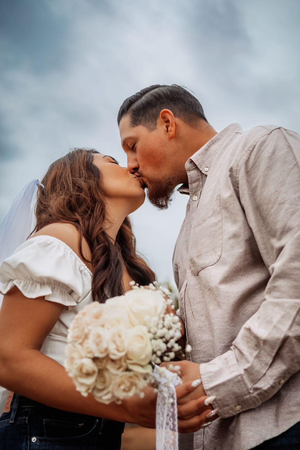Cinematic photography of an engaged couple kissing in Pasadena California