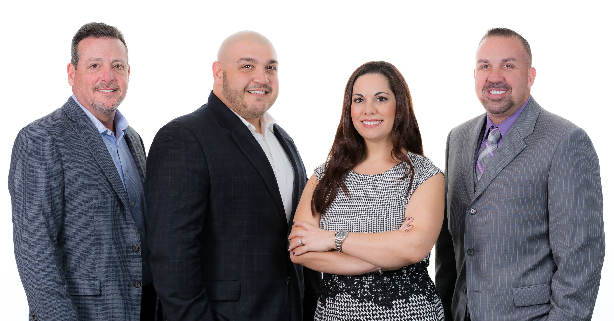 Professional group photo lineup of business team members in formal attire.