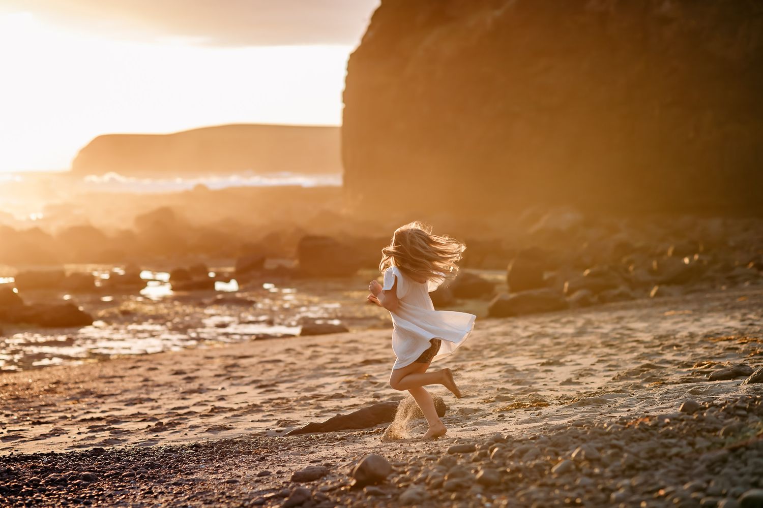 girl dancing during family session by tasmanian family photographer joss jensen
