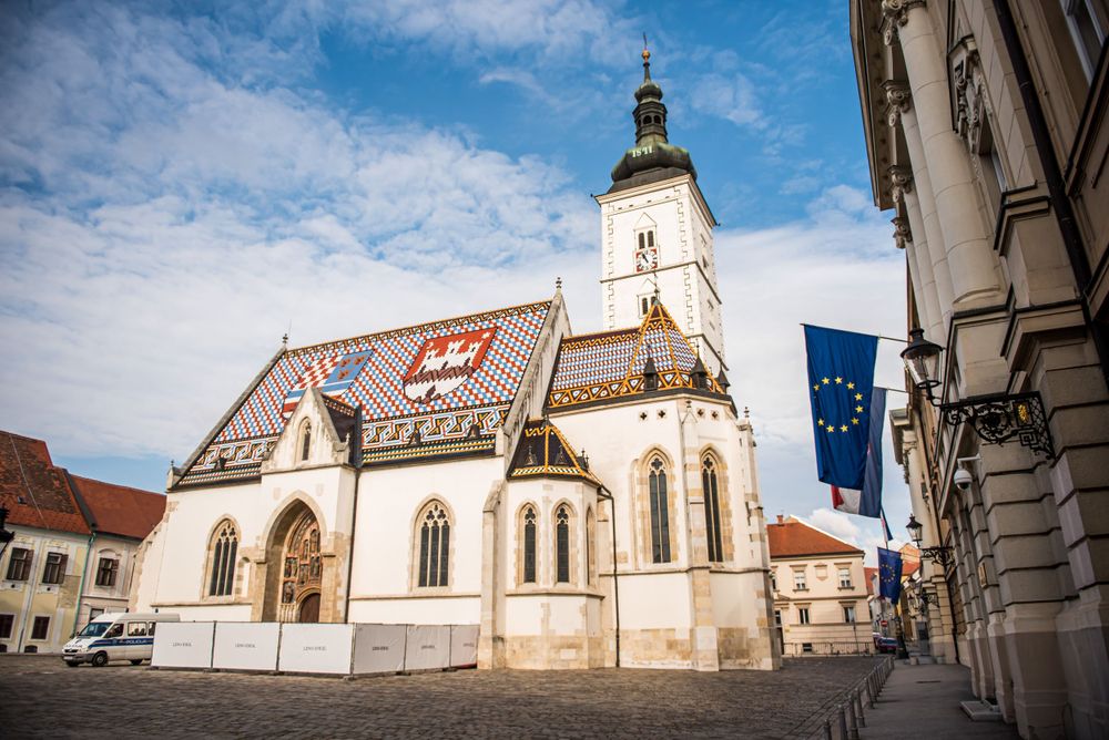 Historic St. Mark's Church in Zagreb with its distinctive colorful tiled roof and Gothic architecture.