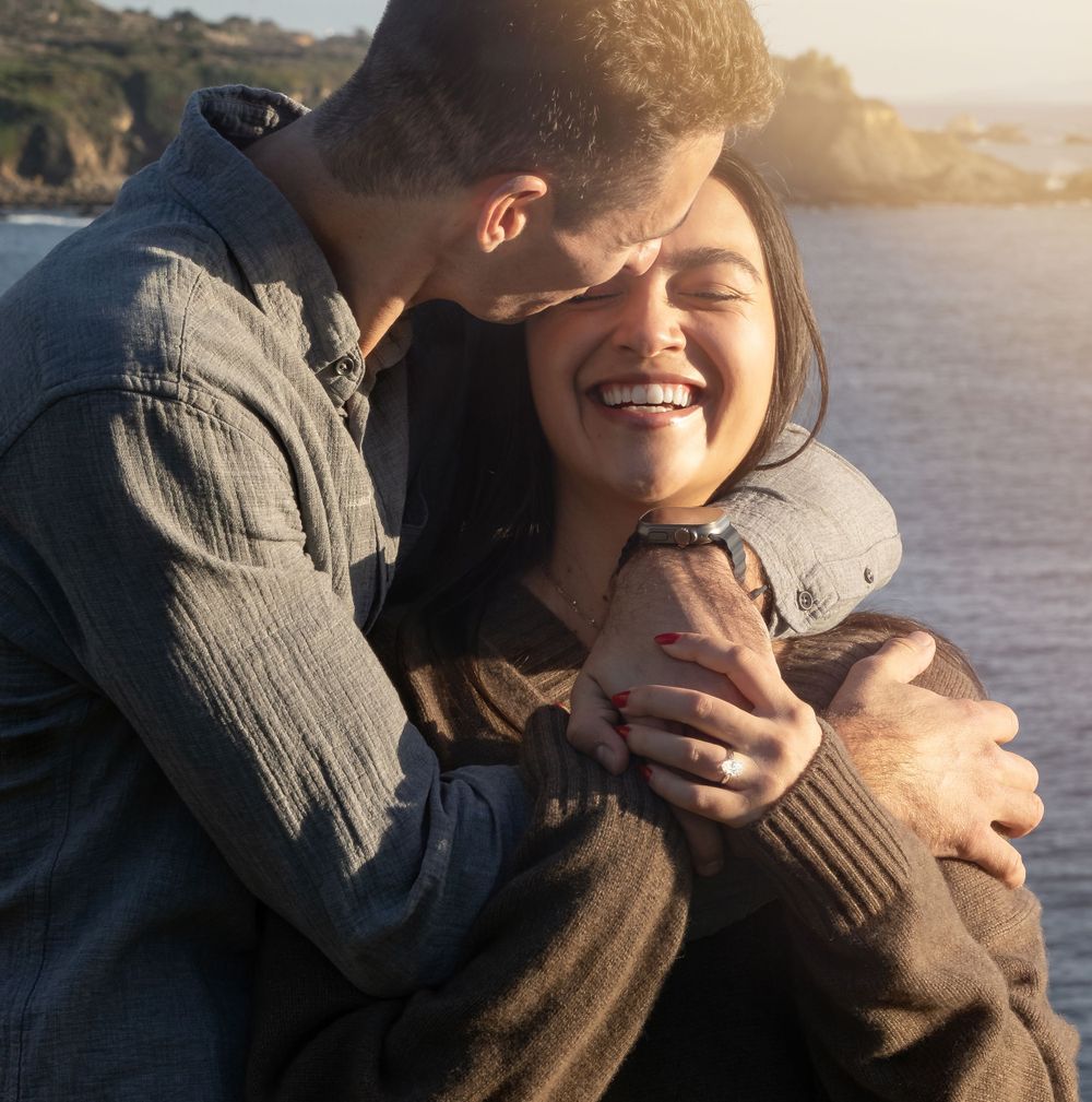 An intimate embrace captured during golden hour by the water. At The Sea Ranch Lodge in Northern California.